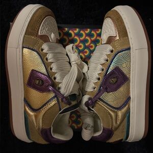 Nike Gold and Purple Sneakers High-Top Design